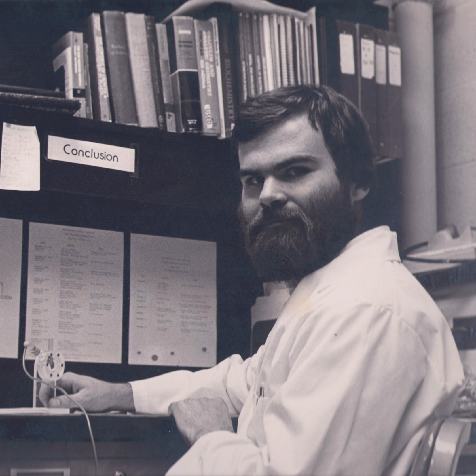 Tom Sharkey poses at his desk as a graduate student in the MSU-DOE Plant Research Laboratory between 1976-1980.