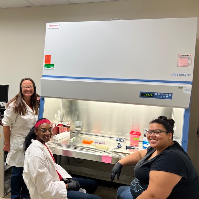 Sarah Lebeis (left) pictured with Ecotek lab student Haley (middle) and technician Asia Hawkins (right). Haley is isolating novel soil bacteria to examine how they impact plant growth.