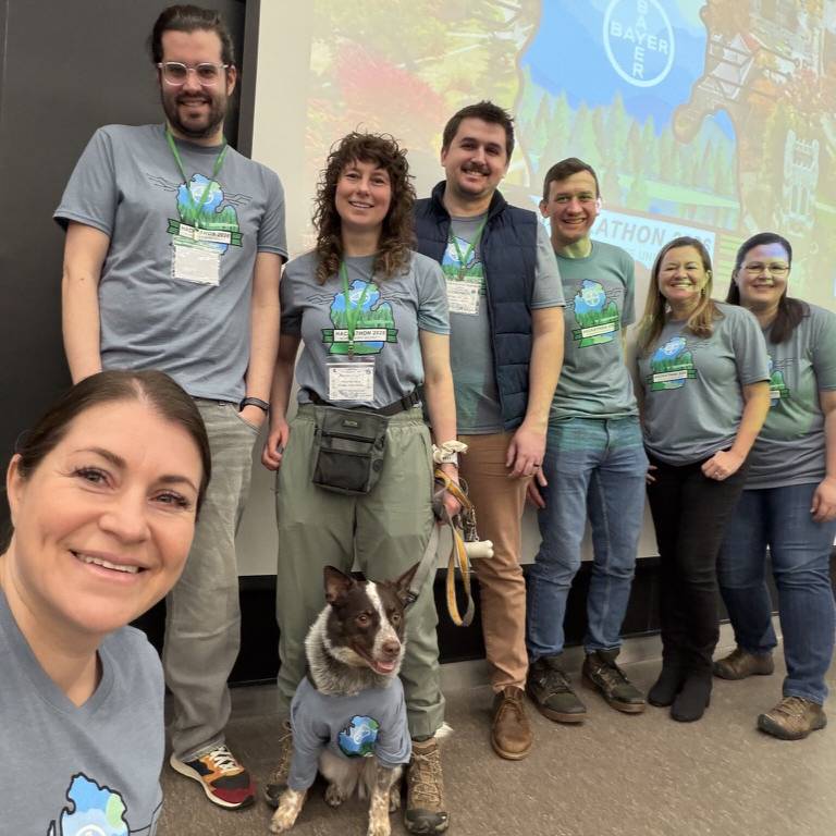 A group of hackathon organizers posing together