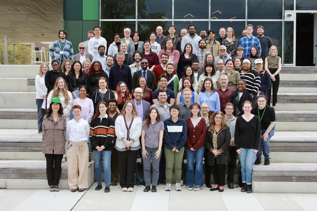 A large group of people pictured together on an outdoor staircase
