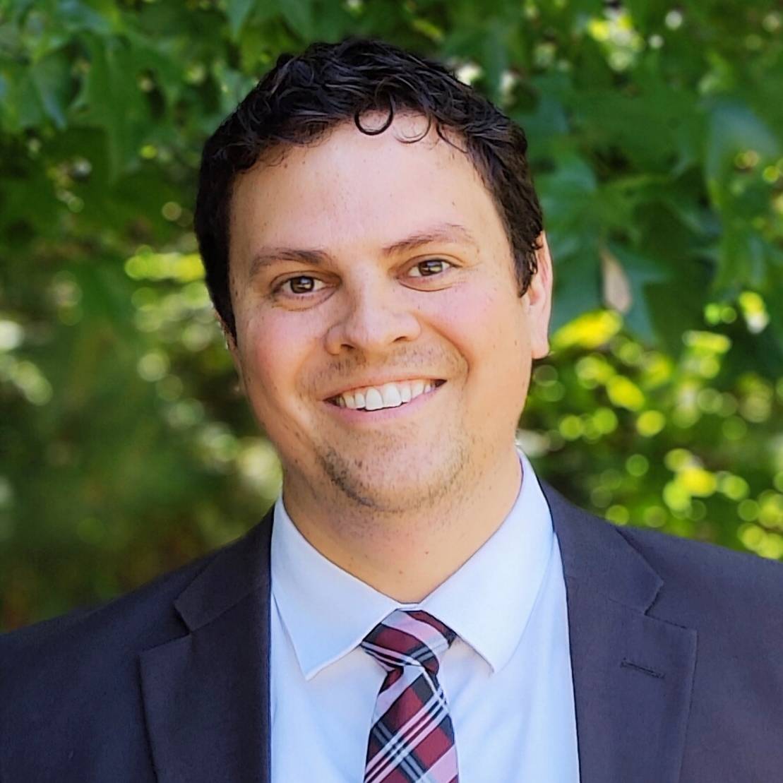 A headshot of Dr. Derek Denney