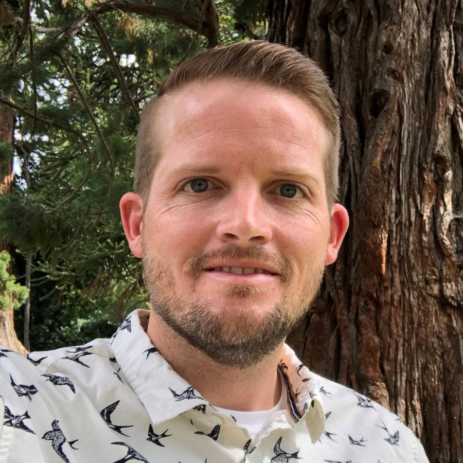 A headshot image of William (Bill) Hammond outside in a forest